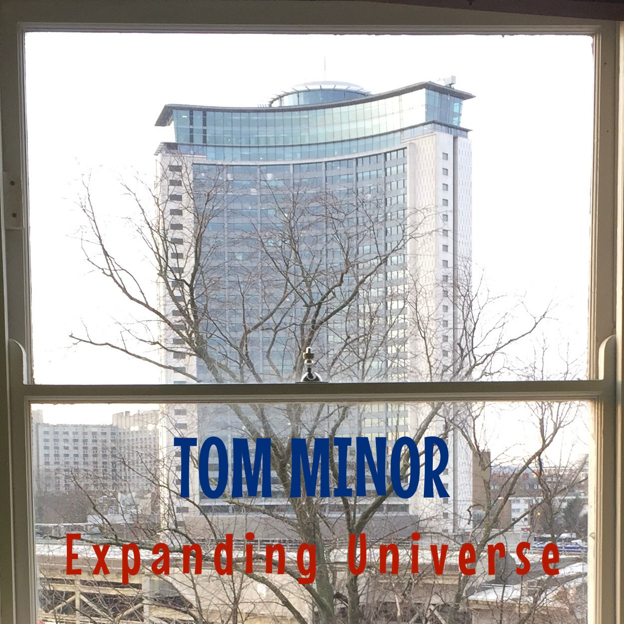 Tom Minor’s “Expanding Universe” – A Timely, Sarcastic Jolt of Existential Indie